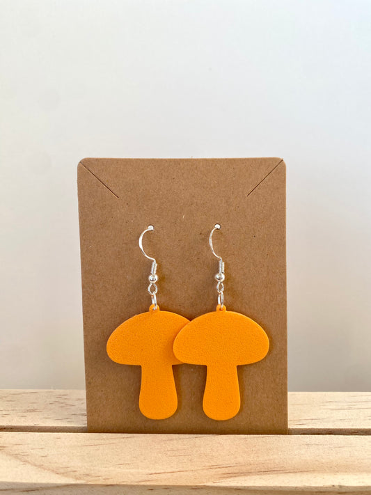 Mushroom Earrings in orange.