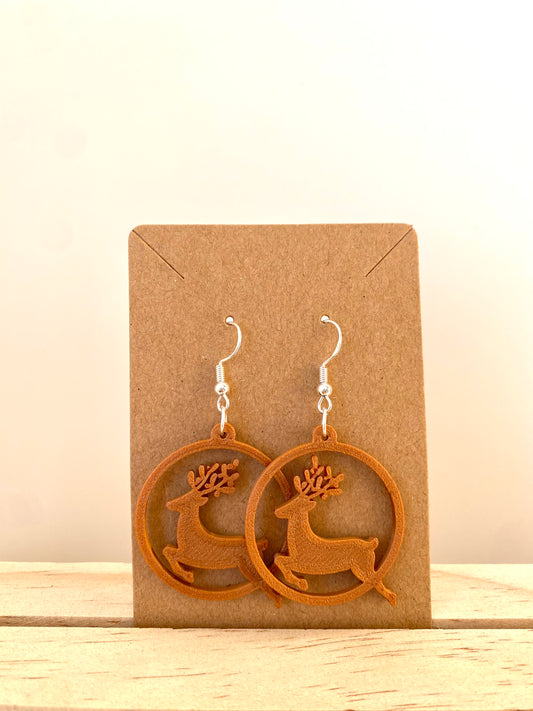 Circle Reindeer Earrings in copper.