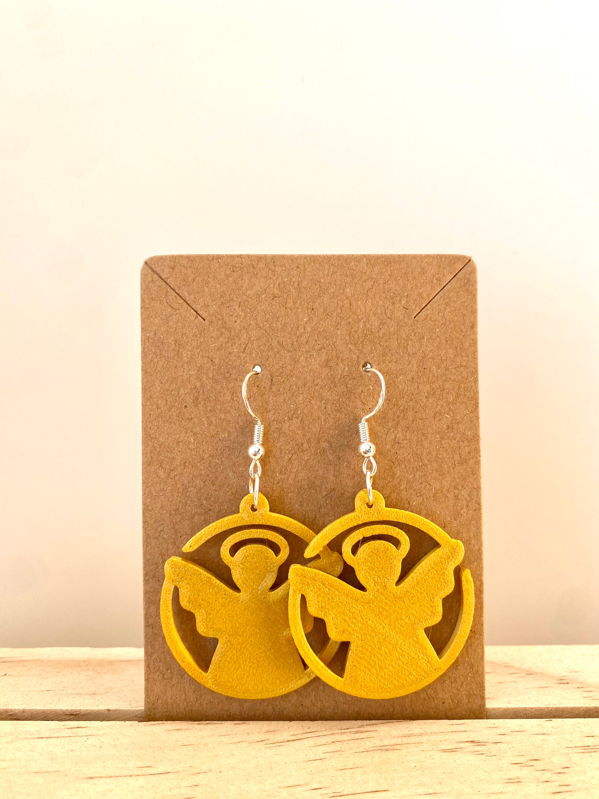 Circle Angel Earrings in gold.