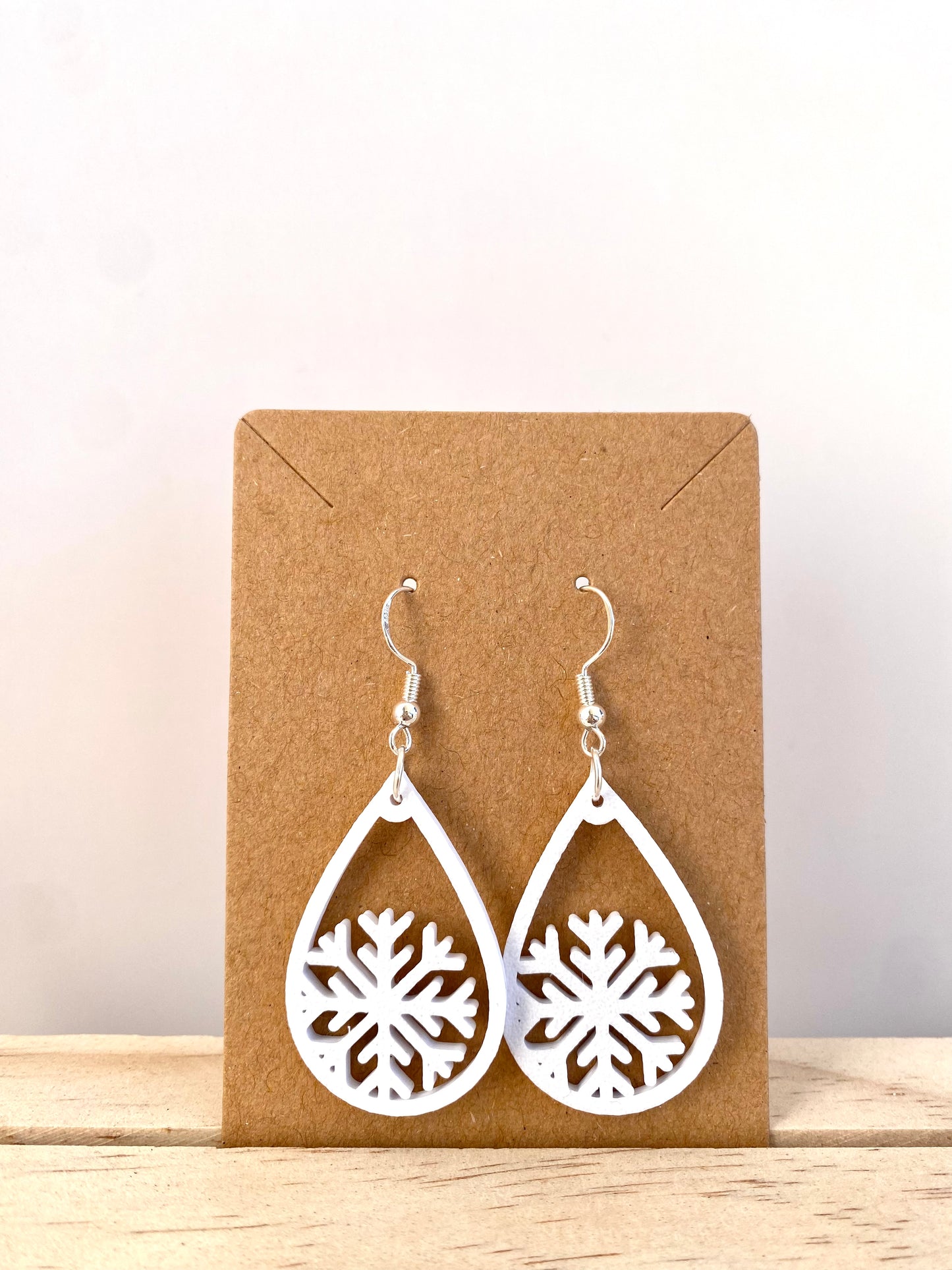Teardrop Snowflake Earrings II in white.